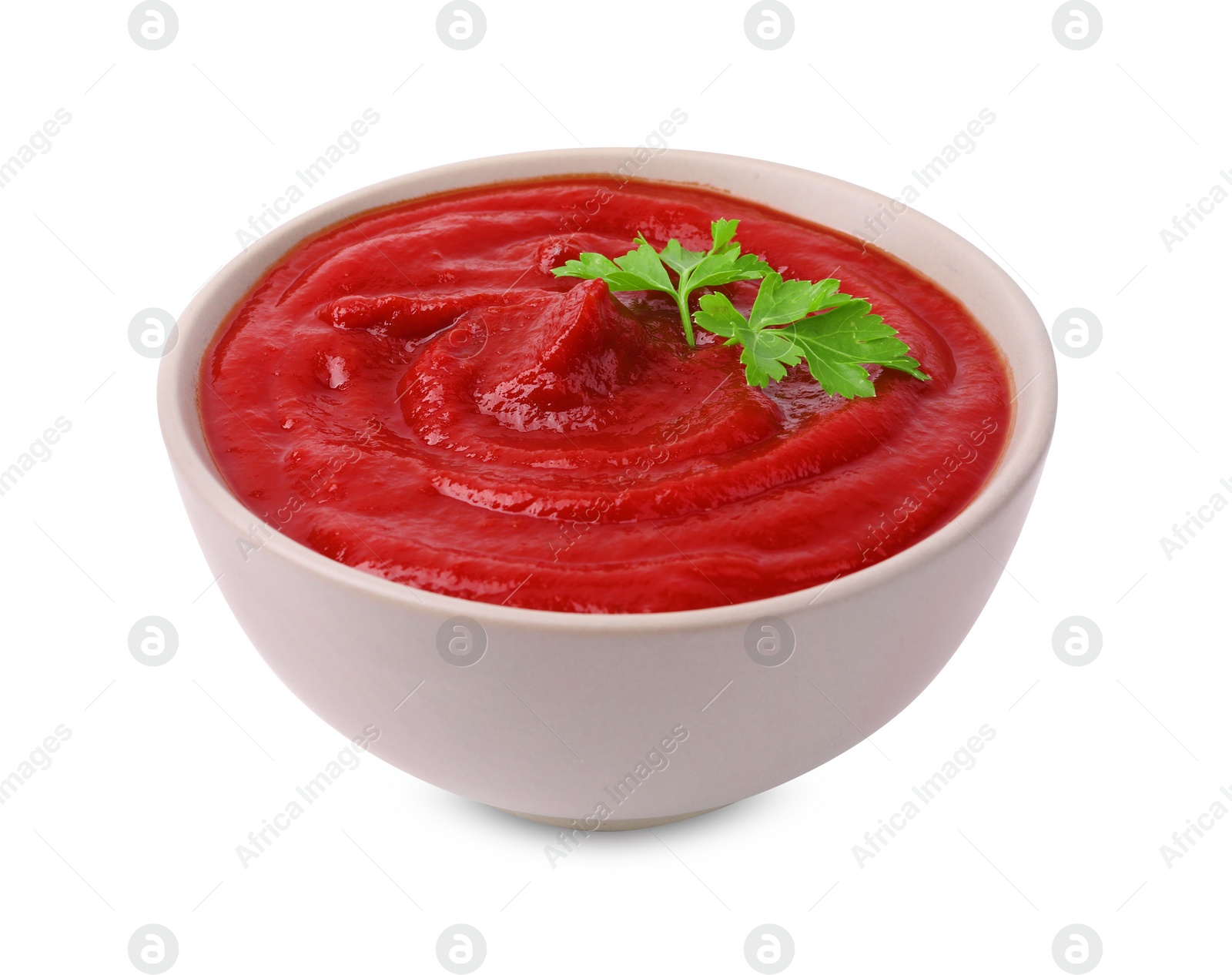 Photo of Organic ketchup and parsley in bowl isolated on white. Tomato sauce