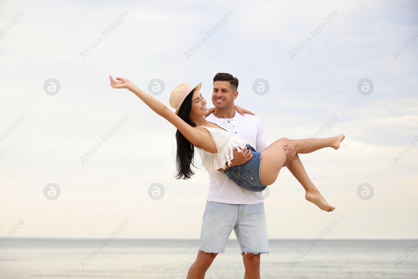 Photo of Lovely couple having fun on beautiful beach