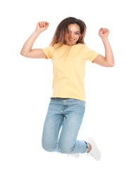Photo of Happy young woman in casual outfit jumping on white background