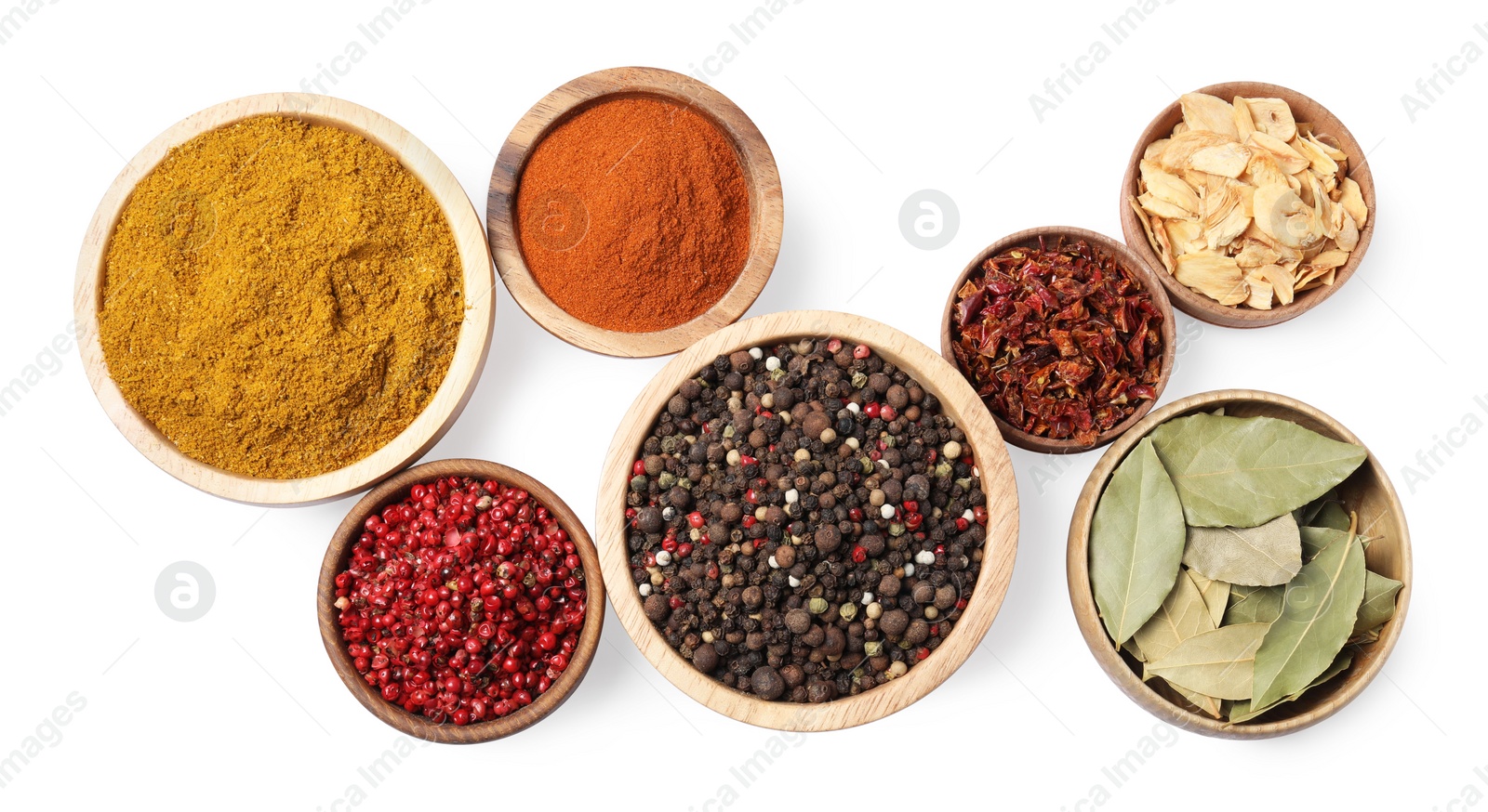 Photo of Bowls with different spices on white background, top view