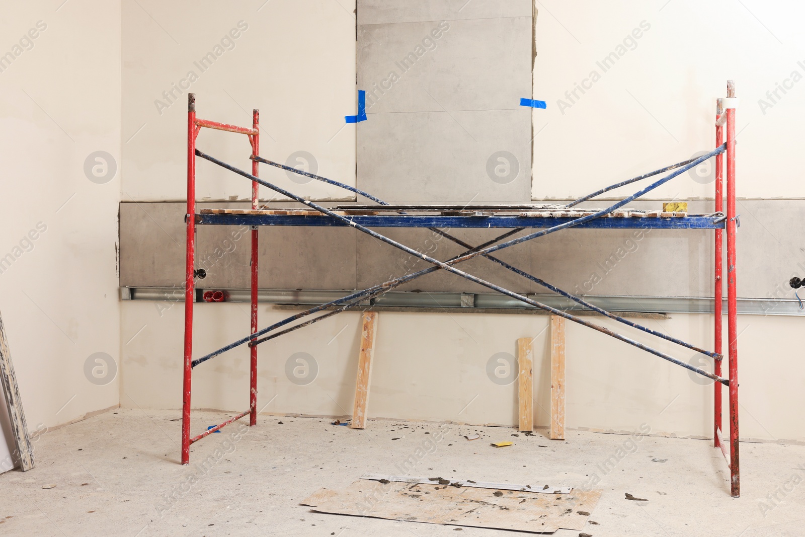 Photo of Tower tour near wall with adhesive mix and tiles indoors