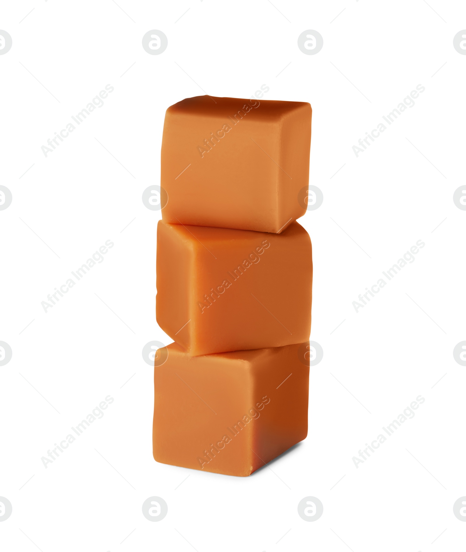 Photo of Stack of caramel candies on white background