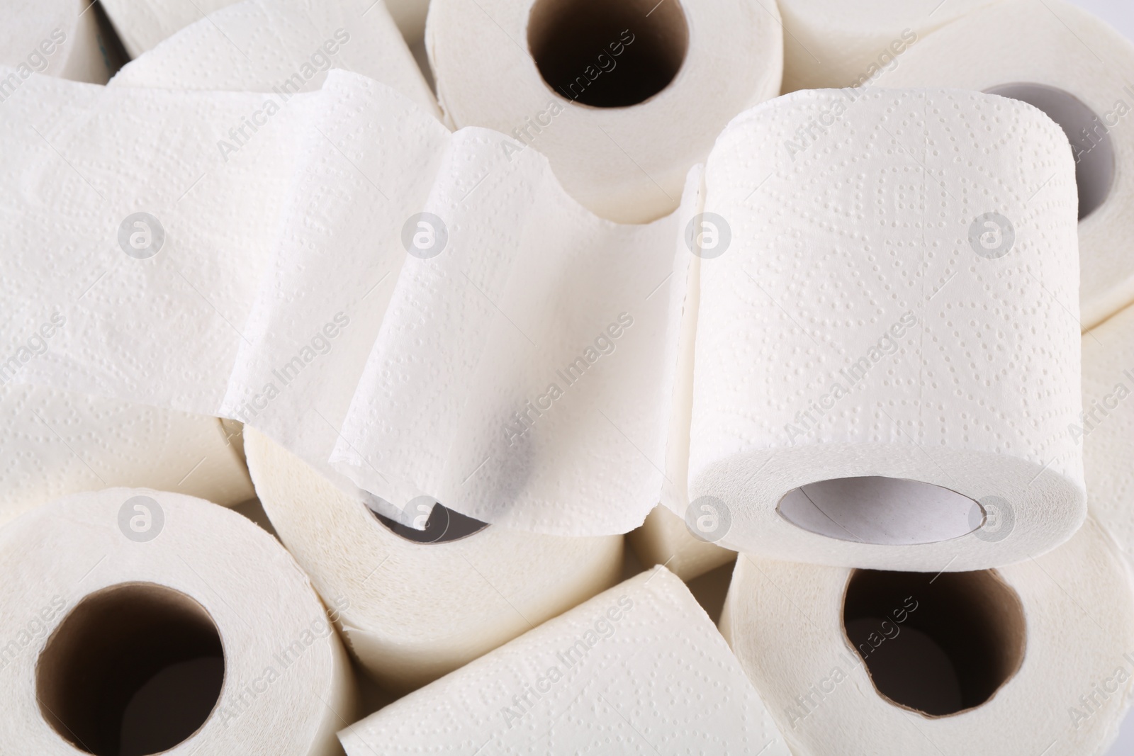 Photo of Many soft toilet paper rolls as background, closeup