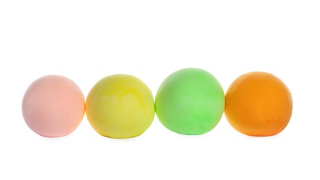 Photo of Row of color play dough balls isolated on white