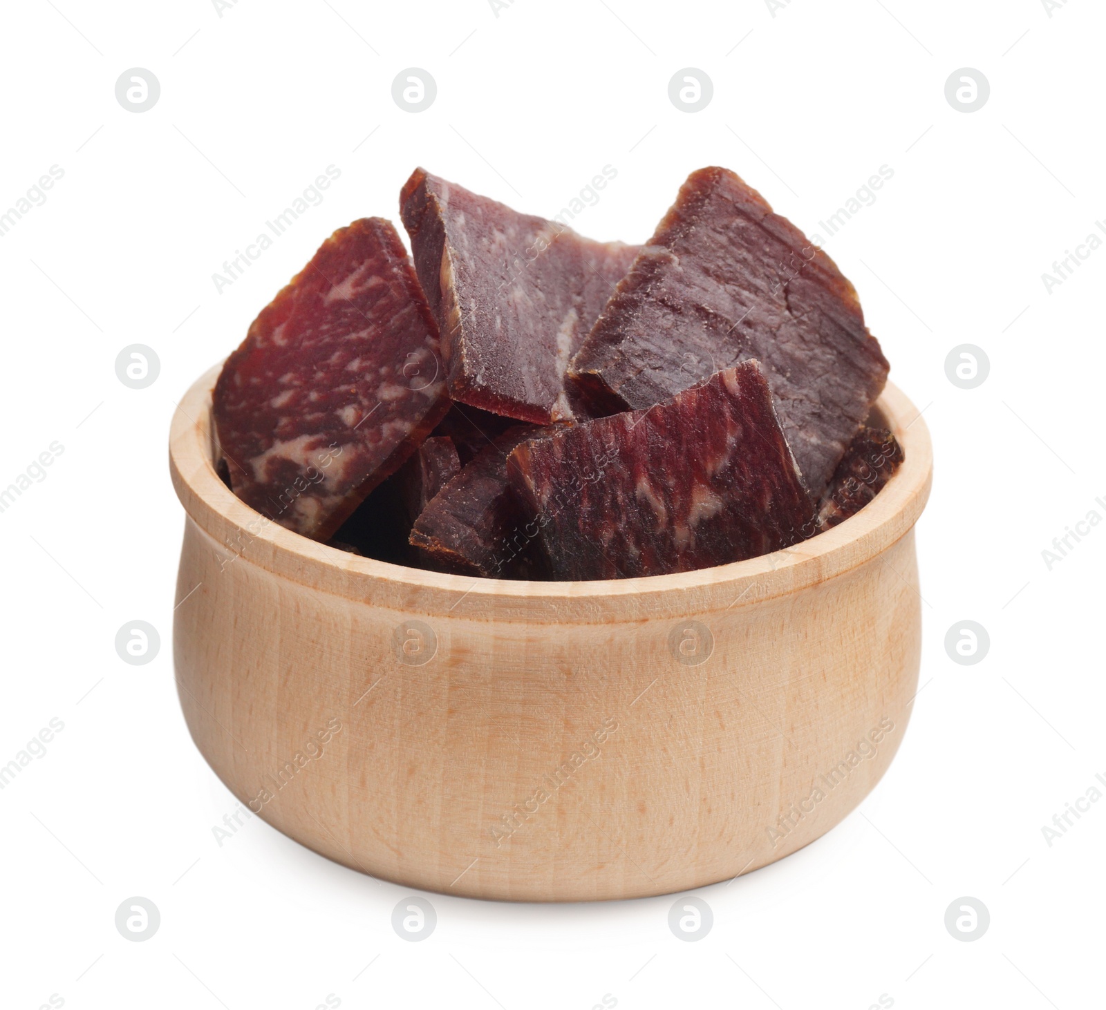 Photo of Delicious beef jerky in wooden bowl isolated on white