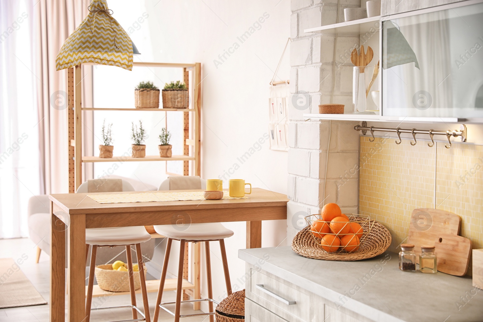 Photo of Modern kitchen interior with stylish wooden table