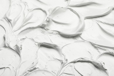 Photo of Texture of white oil paint as background, closeup