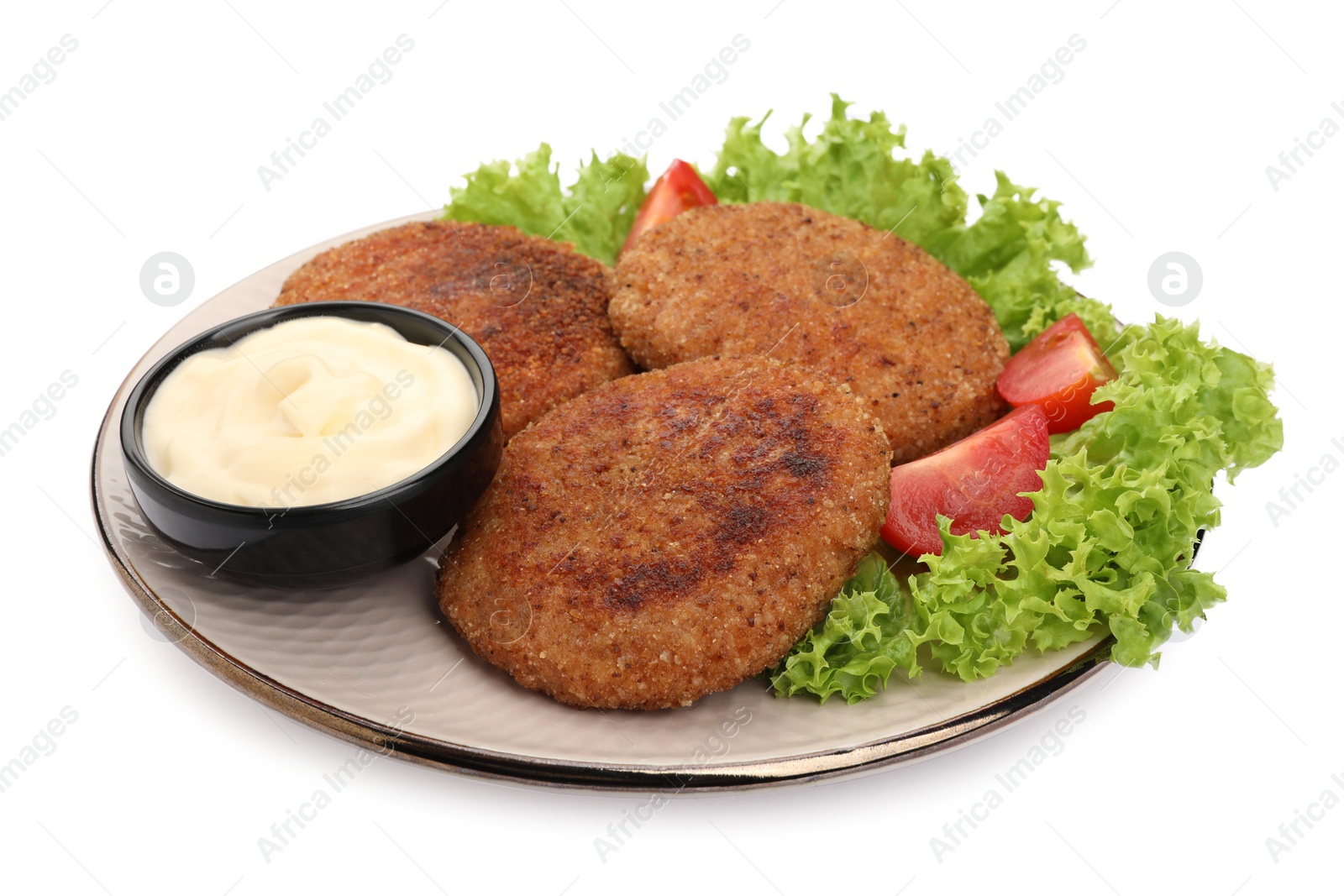 Photo of Plate with delicious vegan cutlets, lettuce, tomato and sauce isolated on white