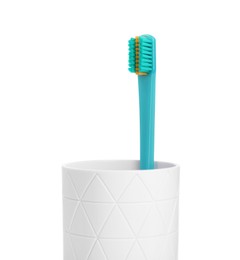 Photo of One plastic toothbrush in holder isolated on white