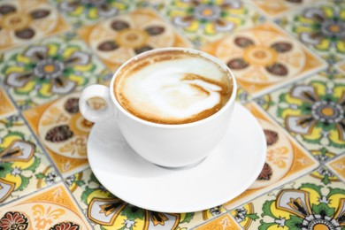 Photo of Cup of aromatic coffee on beautiful table