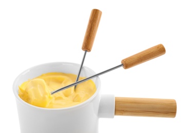 Photo of Pot of tasty cheese fondue and forks isolated on white