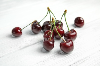 Sweet red cherries on wooden table