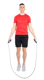 Photo of Full length portrait of young sportive man training with jump rope on white background