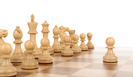 Photo of Pawn in front of other chess pieces on wooden board against white background