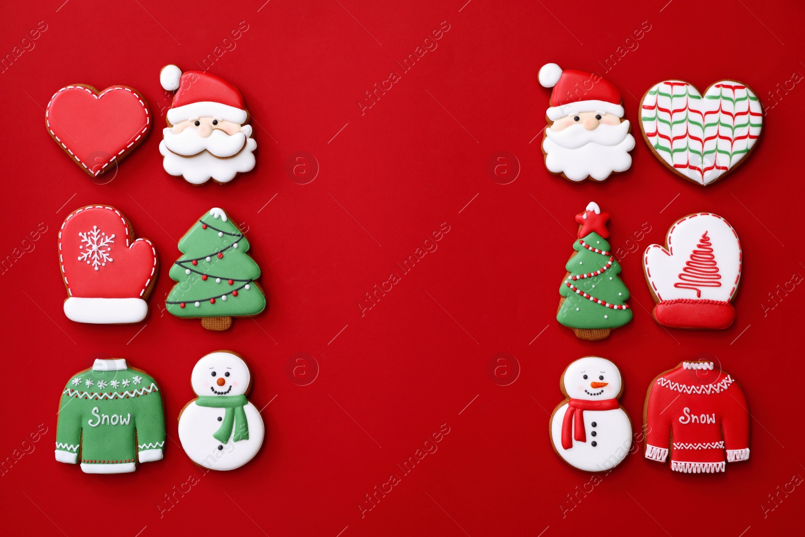 Photo of Different Christmas gingerbread cookies on red background, flat lay. Space for text