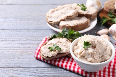 Lard spread served with bread on light grey wooden table. Space for text