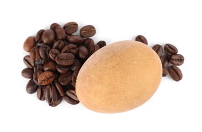 Photo of Easter egg painted with natural dye and coffee beans on white background, top view