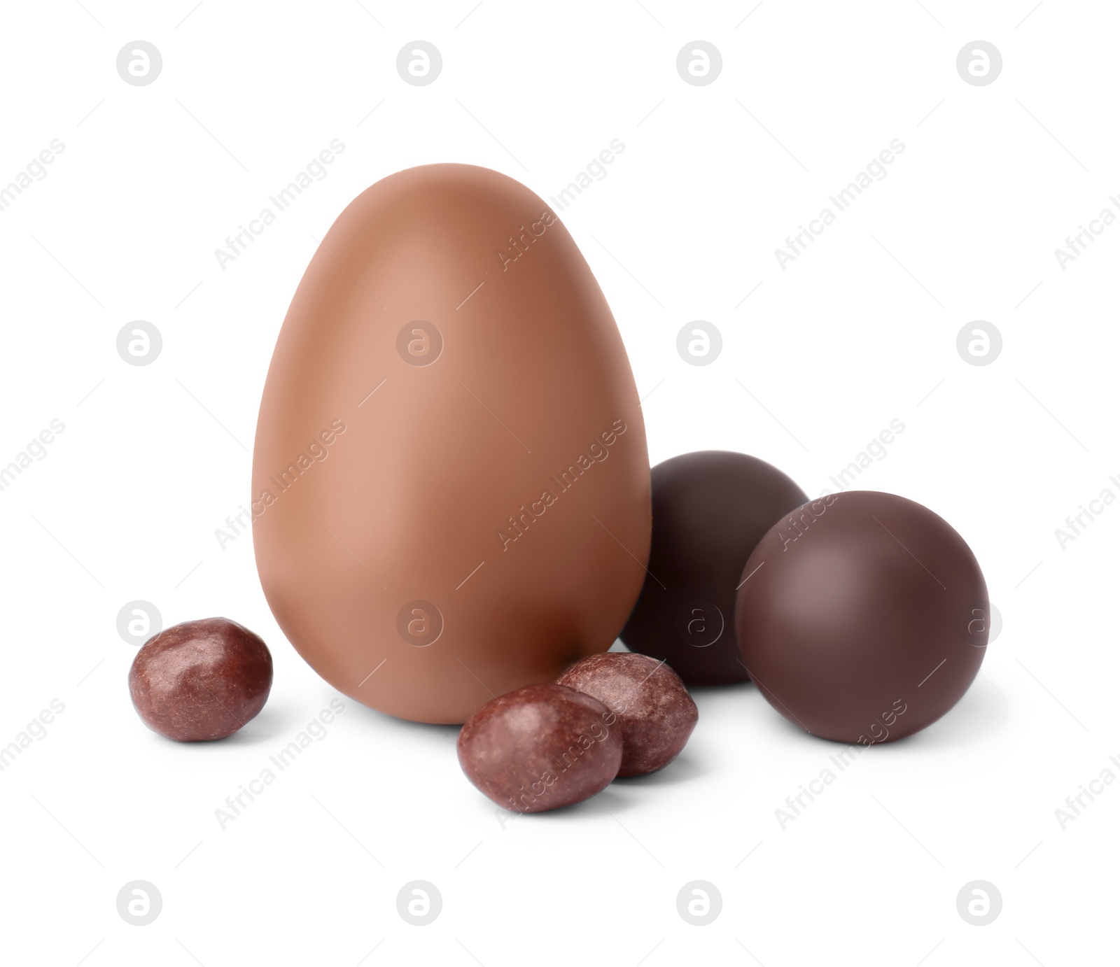 Photo of Tasty chocolate egg and candies isolated on white