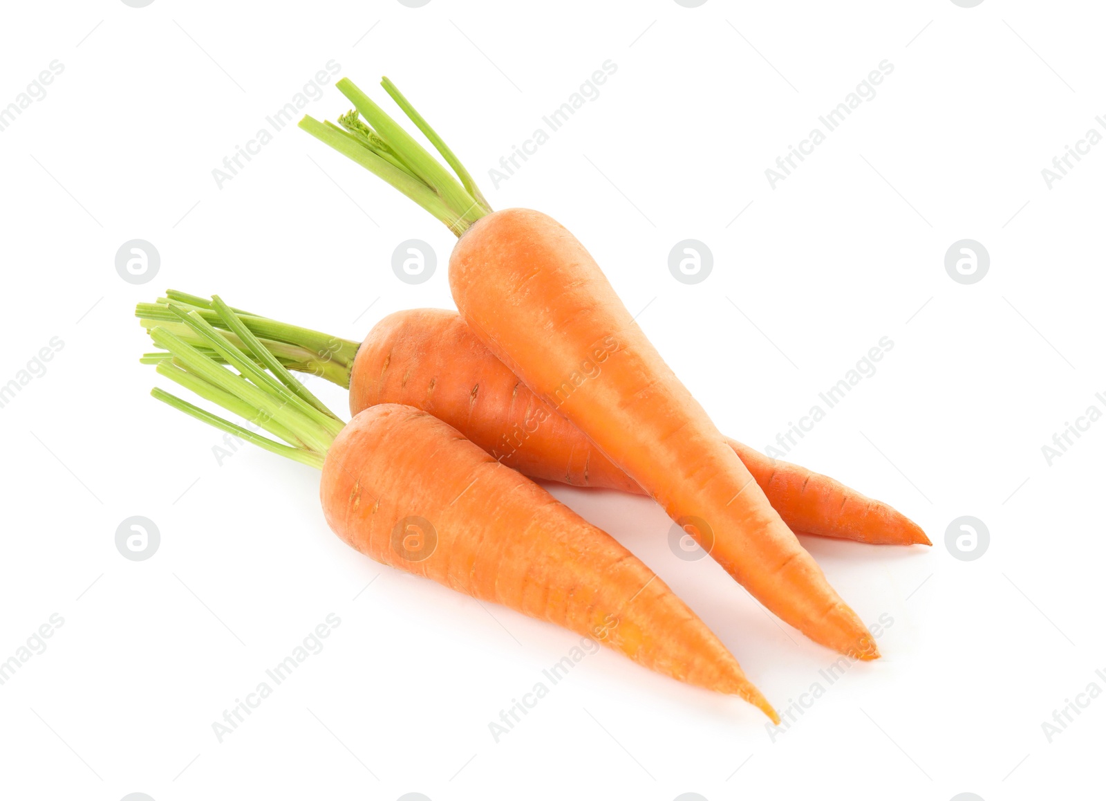 Photo of Pile of fresh ripe carrots isolated on white