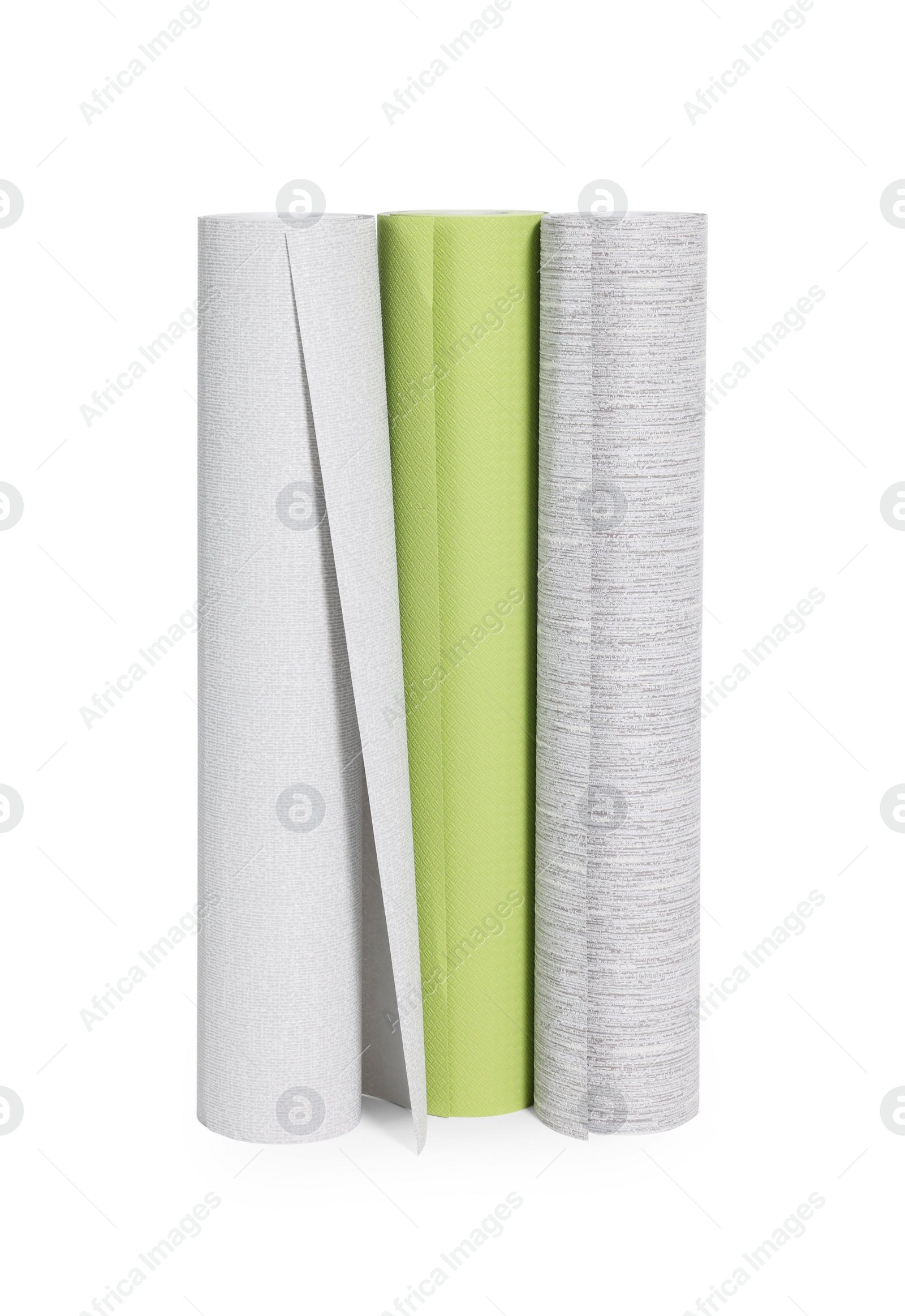 Photo of Three different wallpaper rolls isolated on white