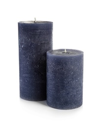 Two decorative wax candles on white background