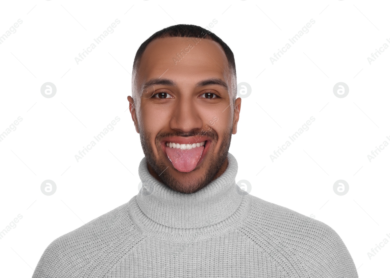 Photo of Happy young man showing his tongue on white background