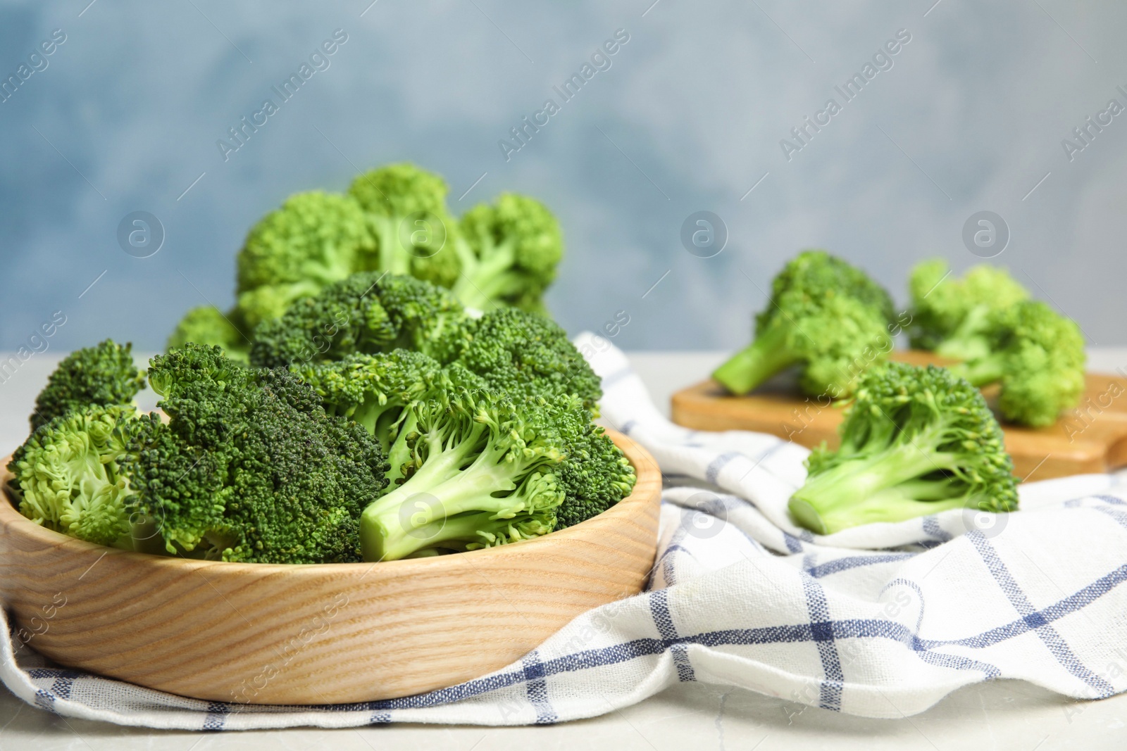 Photo of Fresh green broccoli on table. Space for text