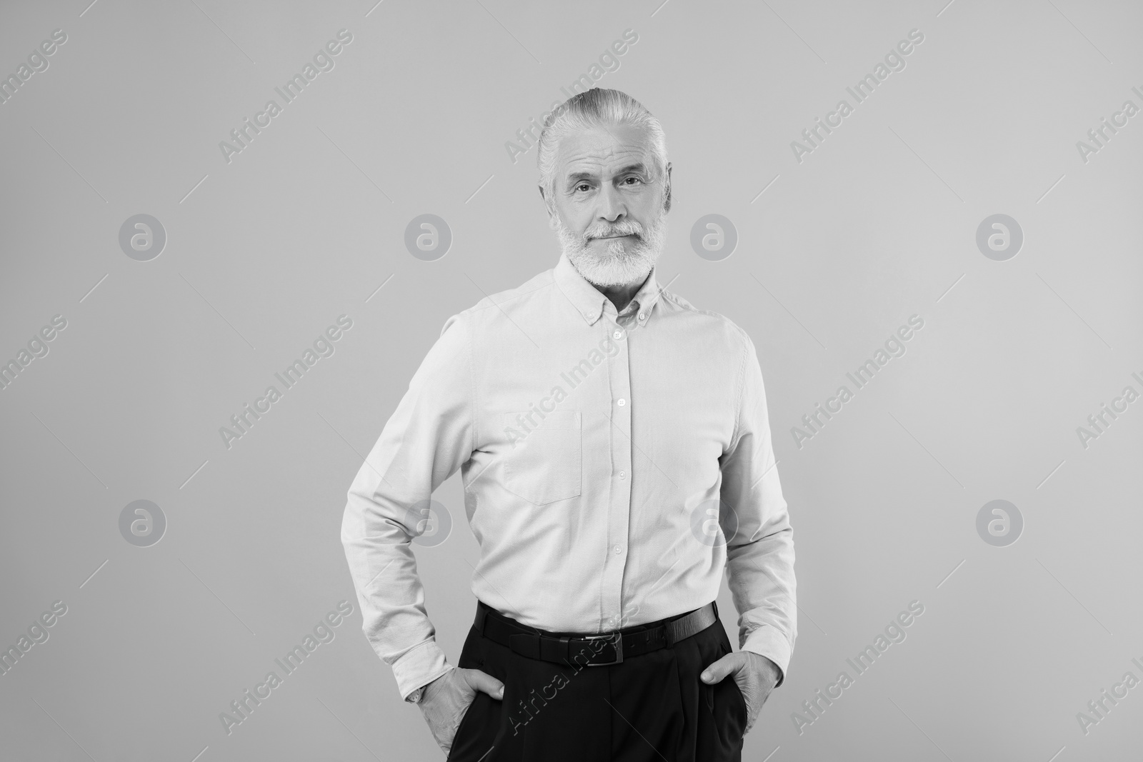 Image of Portrait of handsome senior man on light background. Black and white effect