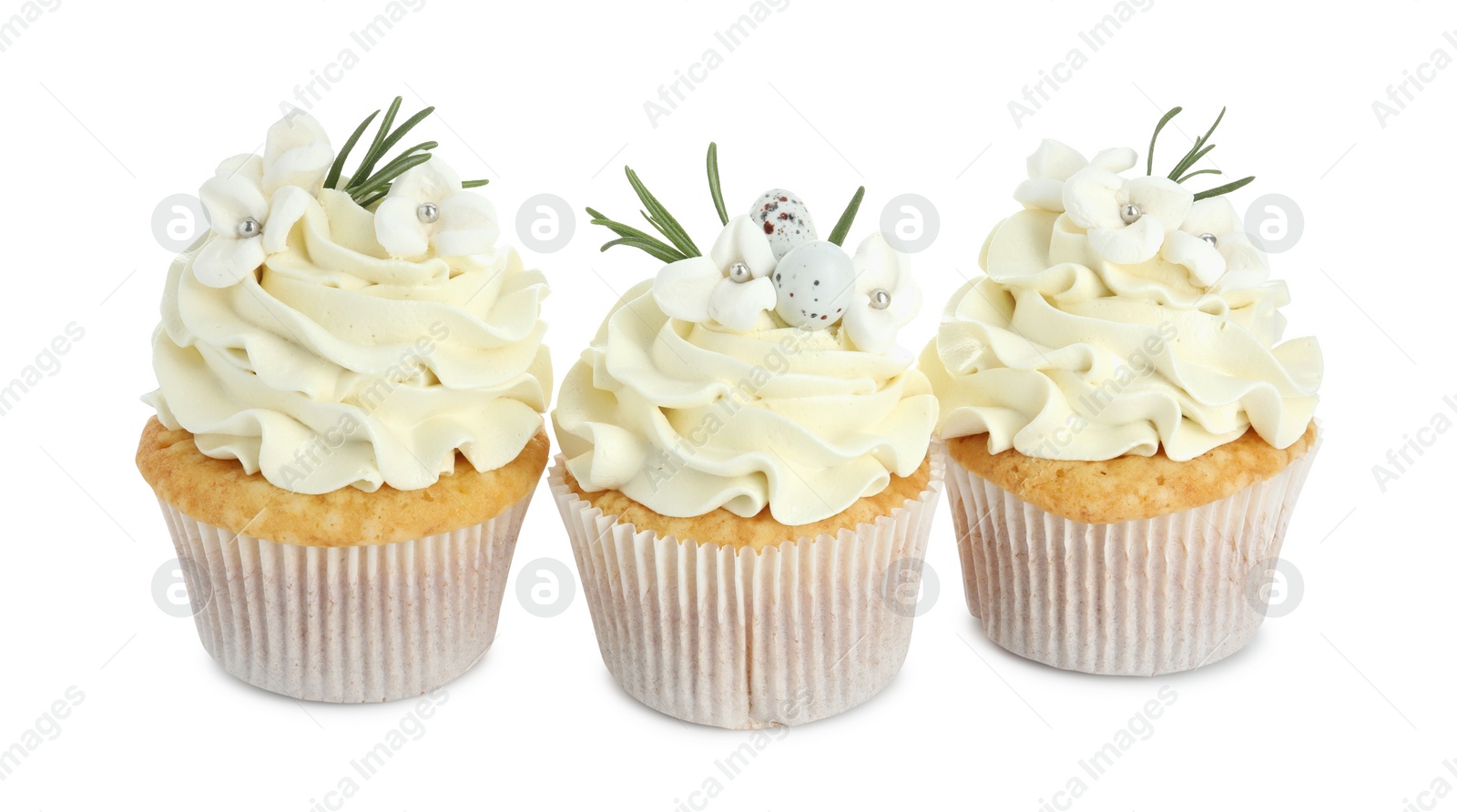 Photo of Tasty Easter cupcakes with vanilla cream isolated on white