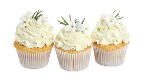 Photo of Tasty Easter cupcakes with vanilla cream isolated on white