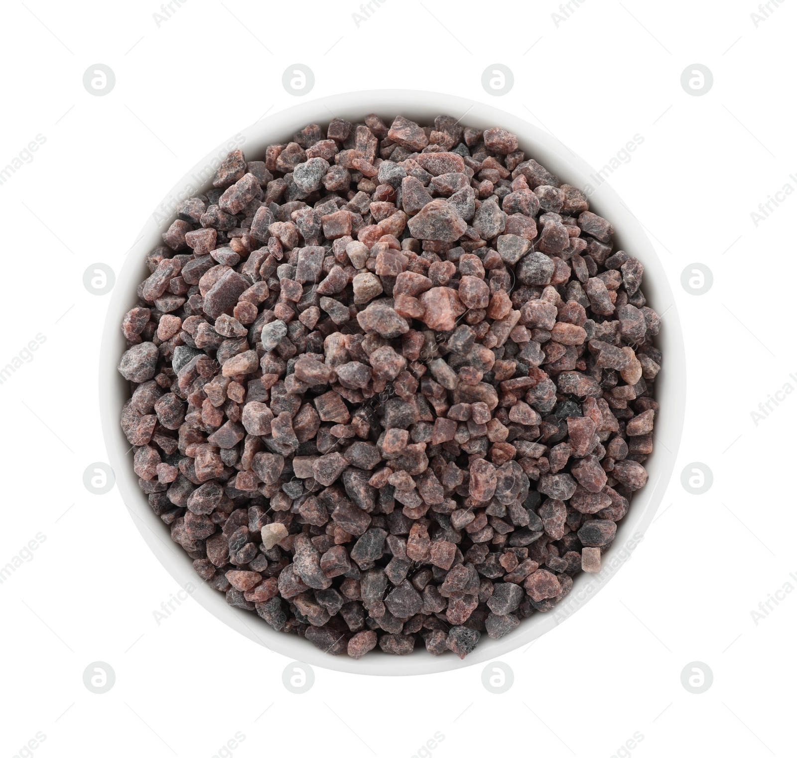 Photo of Black salt in bowl isolated on white, top view