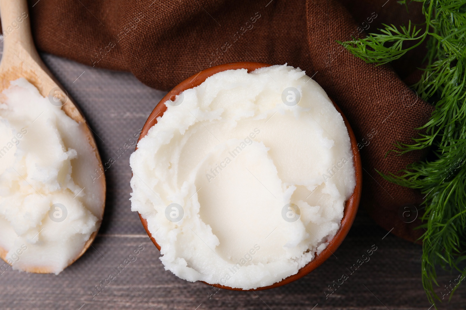 Photo of Delicious pork lard and dill on wooden table, flat lay