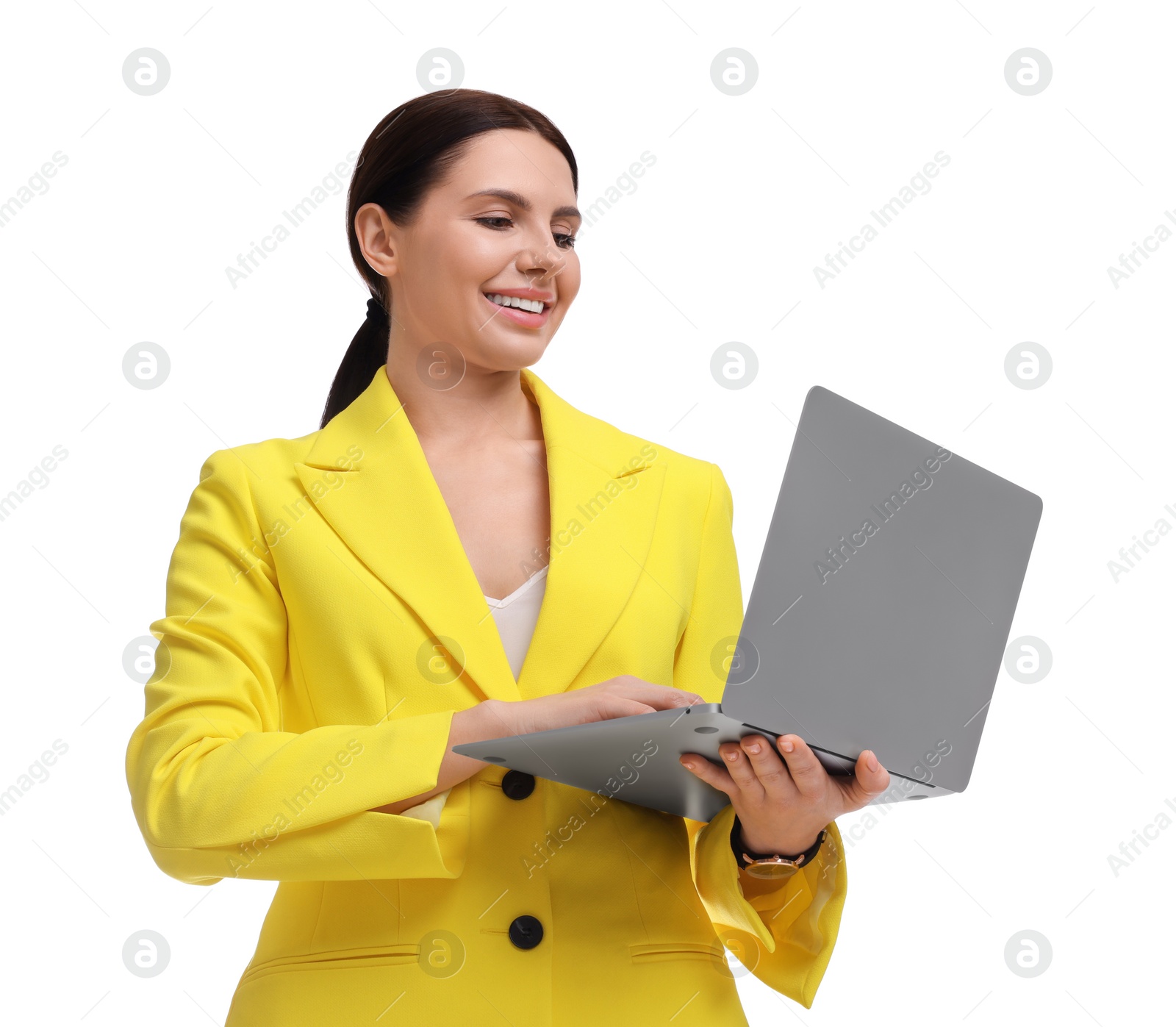 Photo of Beautiful businesswoman in yellow suit with laptop on white background, low angle view