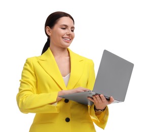 Beautiful businesswoman in yellow suit with laptop on white background, low angle view