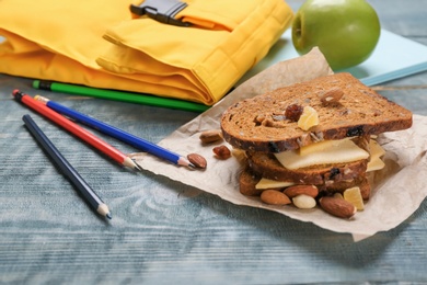 Photo of Tasty sandwich for school lunch on table