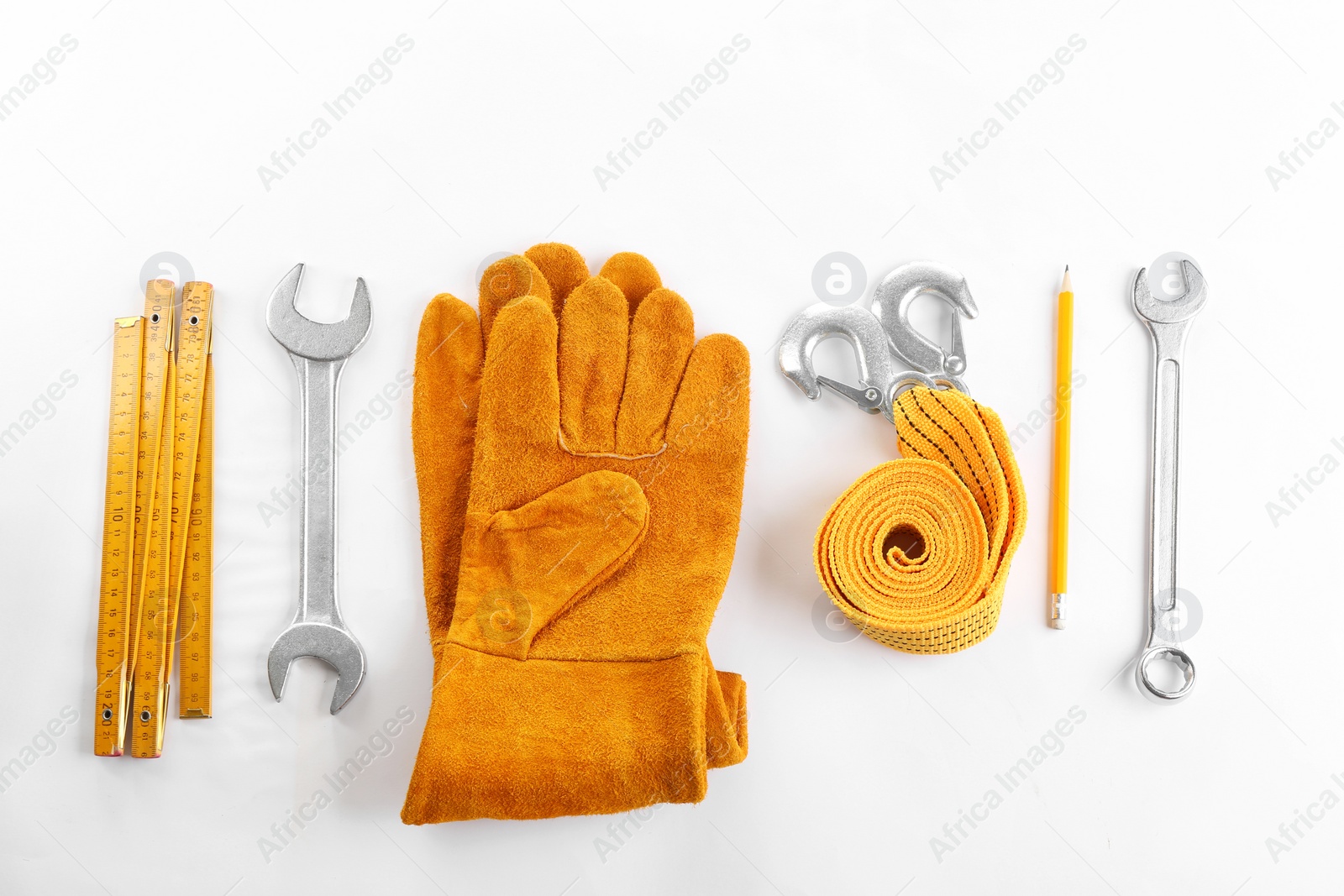 Photo of Flat lay composition with construction tools and safety equipment on white background