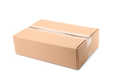 Photo of Closed cardboard box on white background. Mockup for design