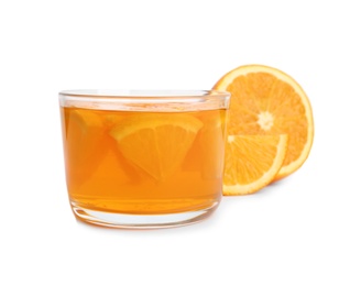 Photo of Slices of orange and tasty jelly dessert in glass on white background