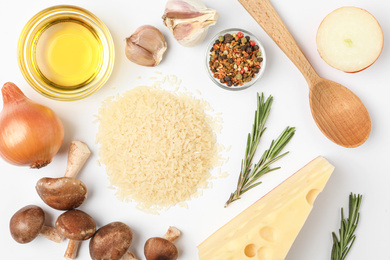 Photo of Different ingredients on white background, top view. Risotto recipe