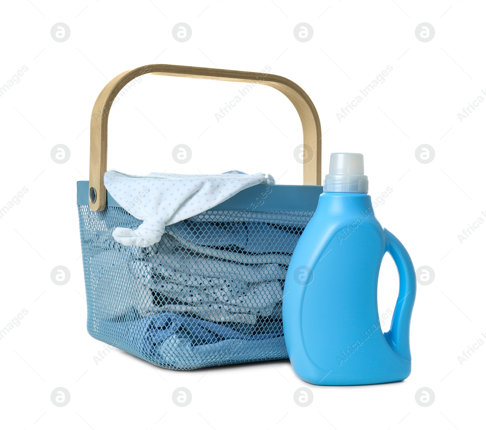 Photo of Basket with fresh baby laundry and bottle of detergent on white background