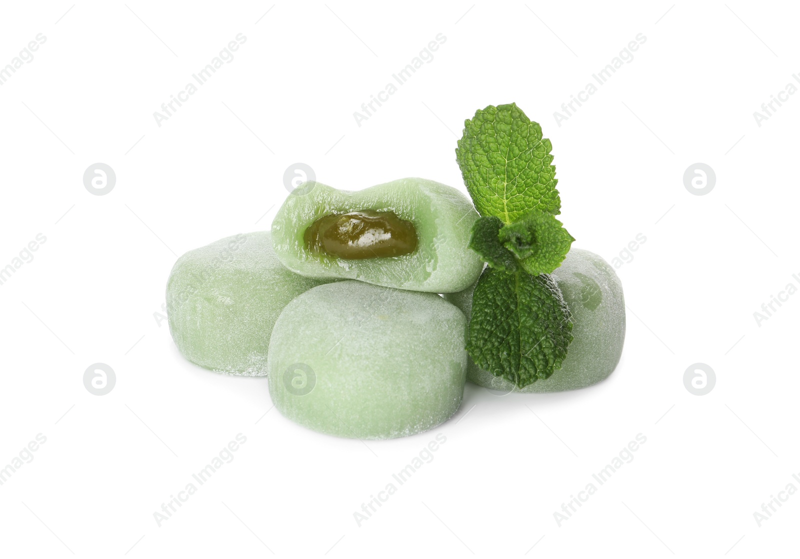 Photo of Delicious matcha mochi and mint leaves on white background