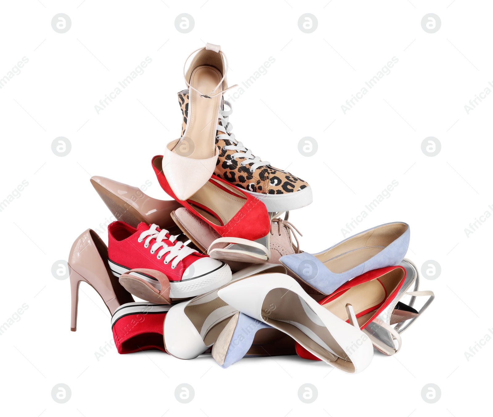 Photo of Pile of different female shoes isolated on white