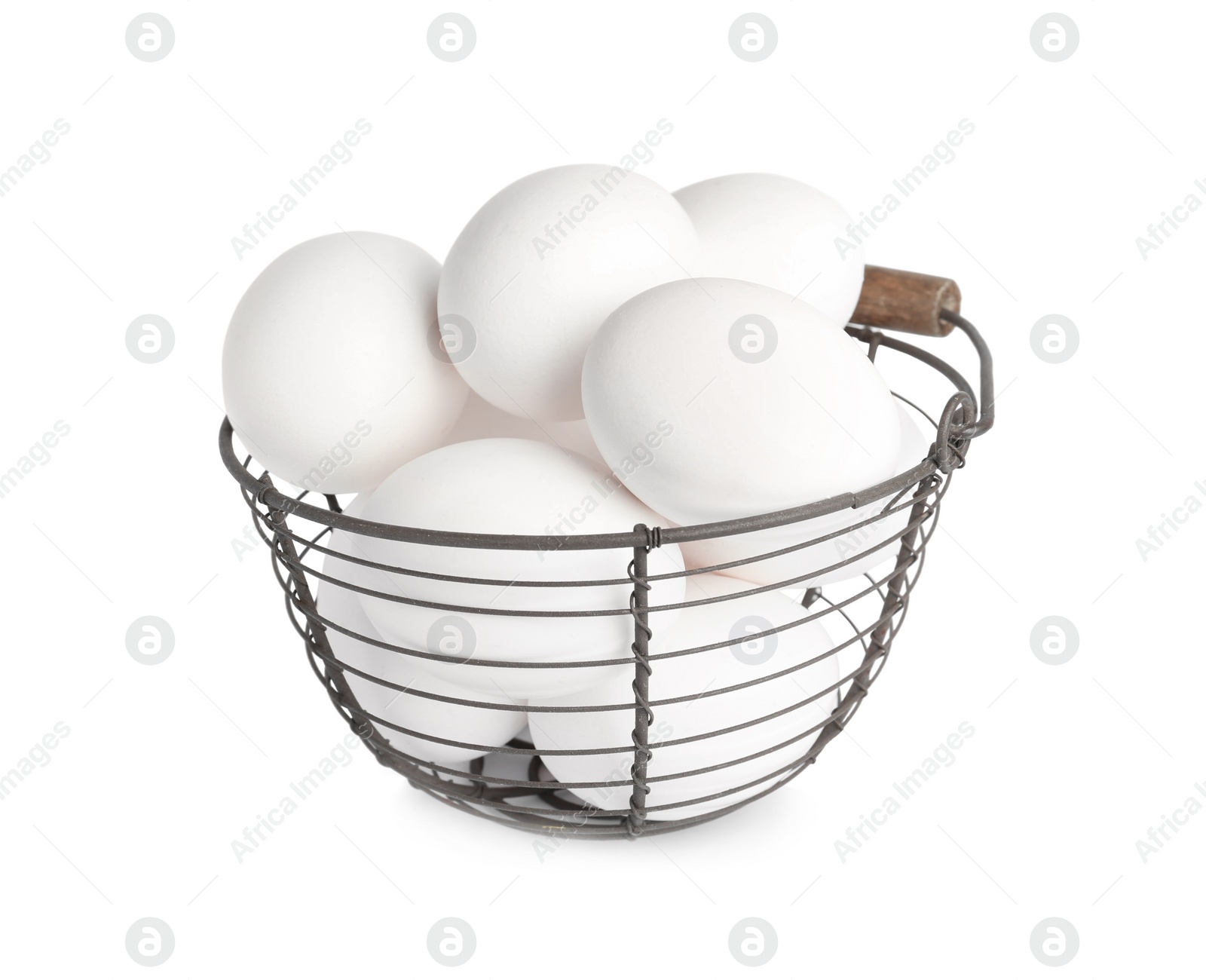 Photo of Chicken eggs in metal basket isolated on white