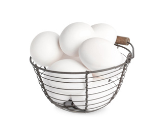 Chicken eggs in metal basket isolated on white