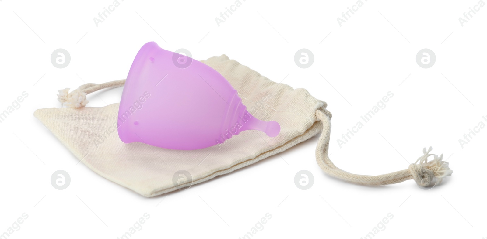 Photo of Silicone menstrual cup with cotton bag on white background