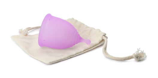 Photo of Silicone menstrual cup with cotton bag on white background