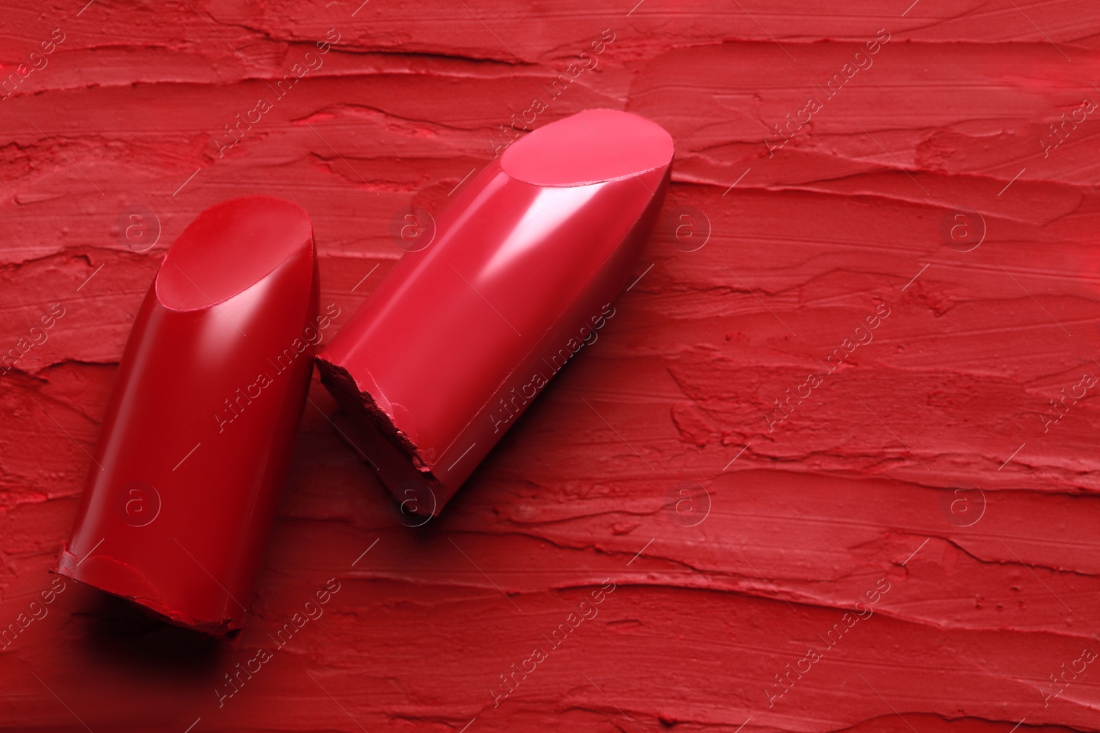 Photo of Many bright lipsticks and smears, top view