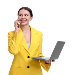 Photo of Beautiful businesswoman in yellow suit with laptop talking on smartphone against white background