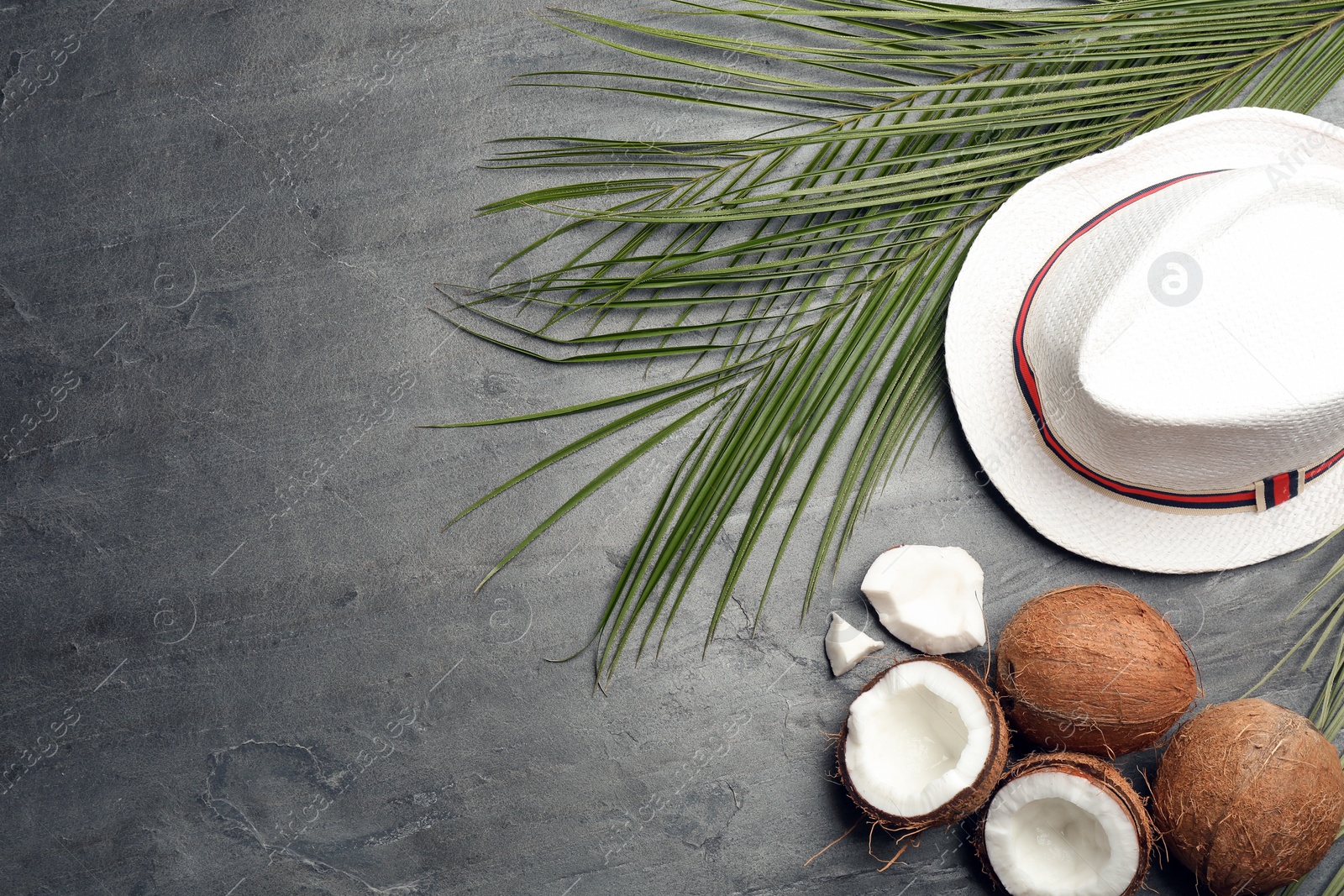 Photo of Flat lay composition with coconuts and space for text on grey background