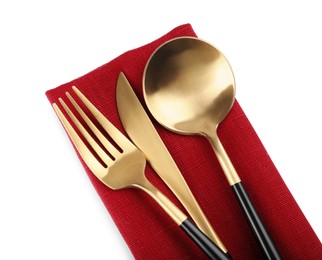 Photo of Red napkin with golden cutlery on white background, top view
